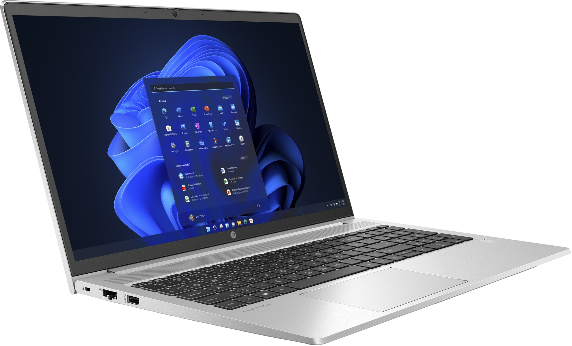 Un portátil plateado muestra una interfaz de Windows. La pantalla muestra iconos de aplicaciones y un fondo azul. Fondo blanco.
