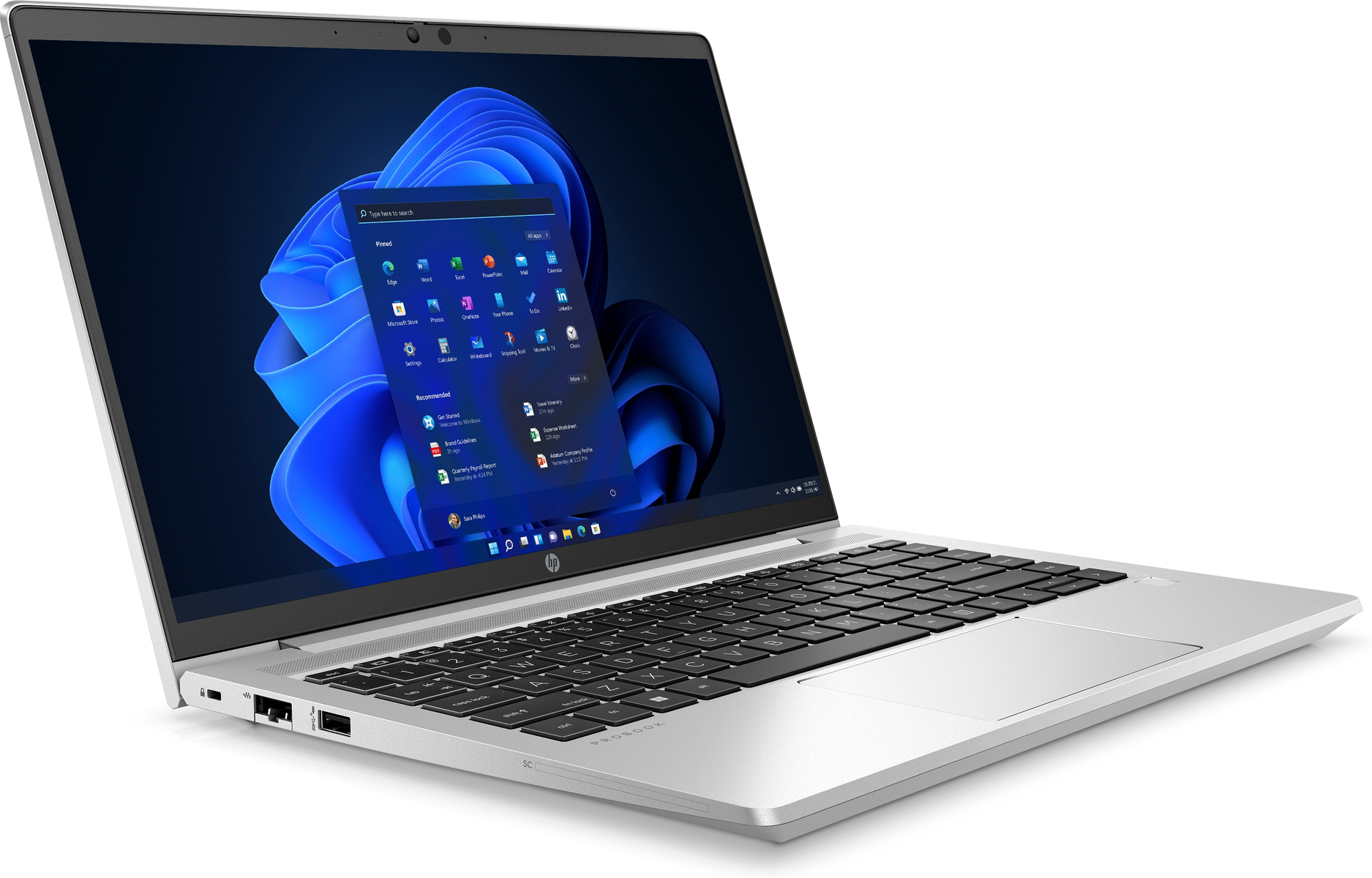 Portátil plateado abierto, mostrando la interfaz de Windows 11. Se ve un teclado negro.