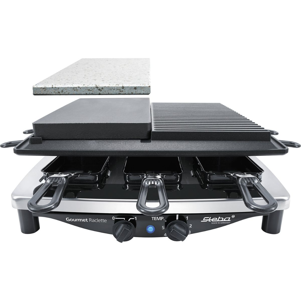 Ein Gourmet-Raclette-Grill mit drei Pfannen, einer Steinplatte und einer Grillplatte. Der Grill ist silber und schwarz.