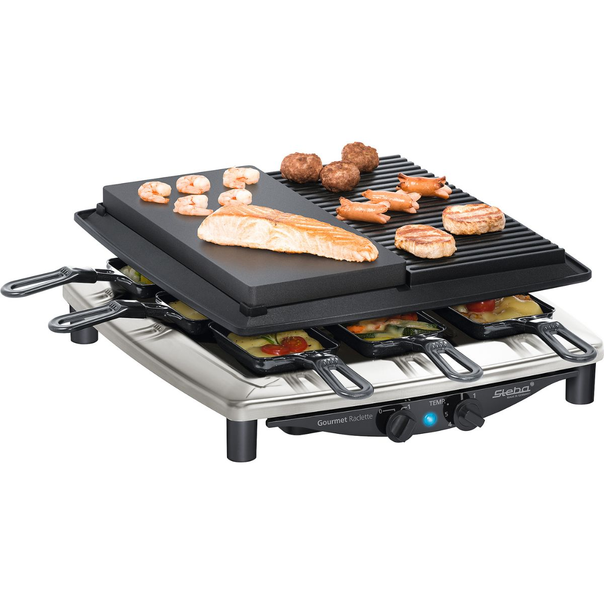 Raclette-Grill mit Essen, darunter Fleisch und Gemüse. Der Hintergrund ist weiß.