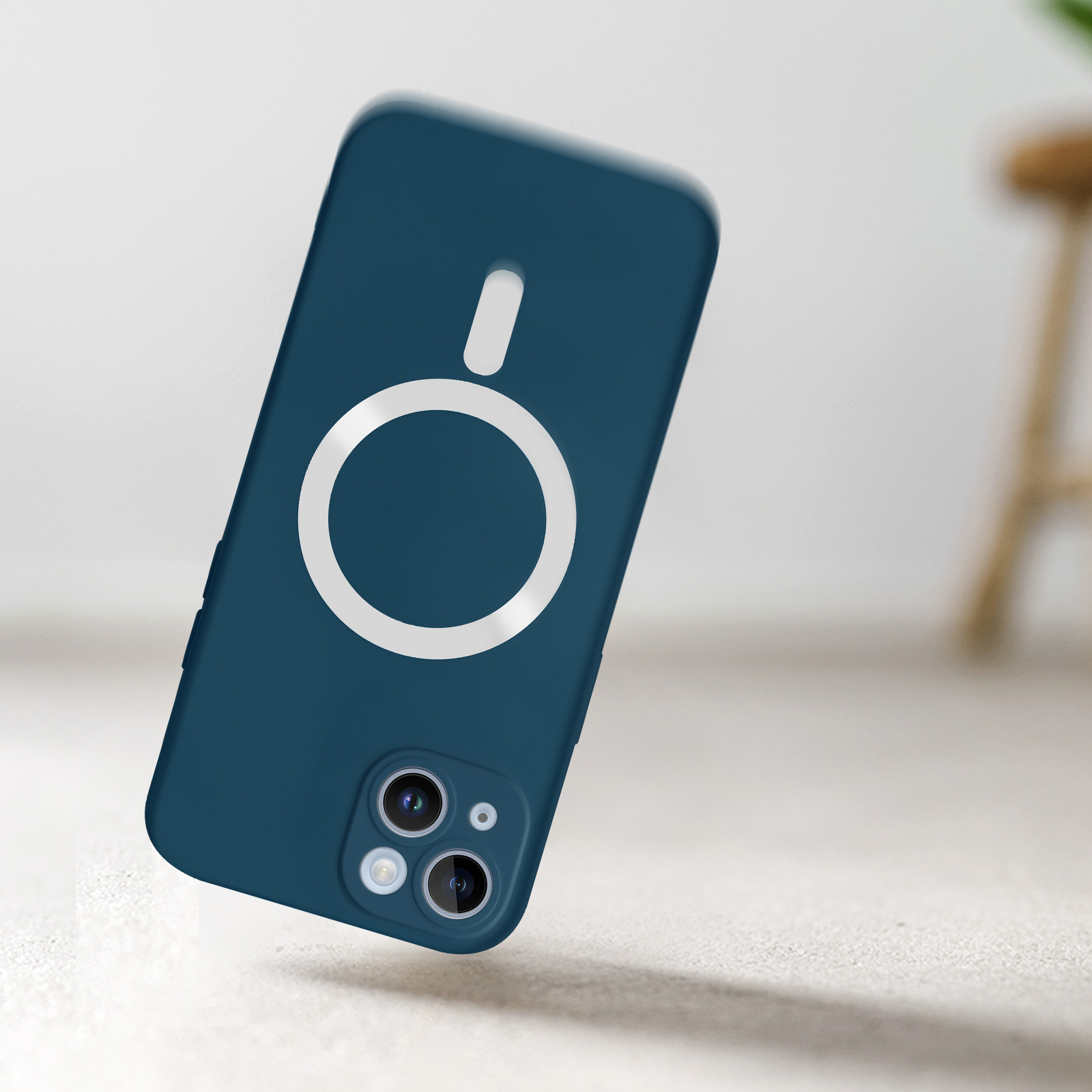 Una custodia blu per telefono con anello bianco e lenti della fotocamera fluttuanti.
