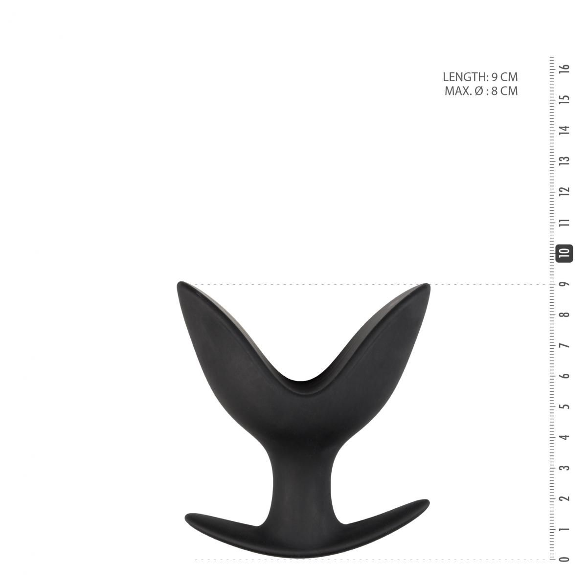 Ein schwarzes, Y-förmiges Sexspielzeug vor weißem Hintergrund mit Messskala. Die Länge beträgt 9 cm.