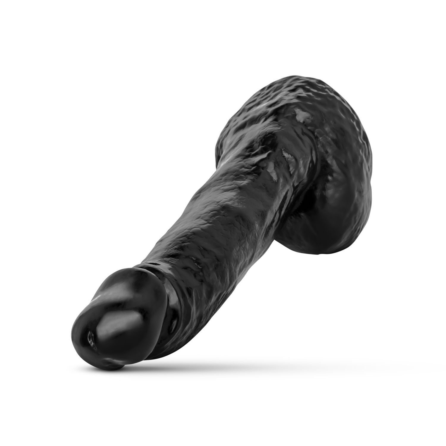 Un objeto negro con forma fálica, posiblemente un juguete sexual, sobre un fondo blanco. Tiene una cabeza redondeada y un eje texturizado.