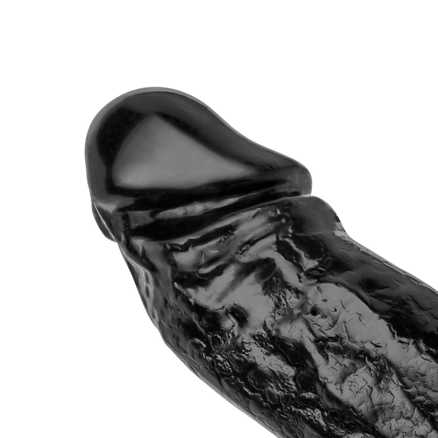 Un objeto negro con forma fálica, posiblemente un juguete sexual, sobre un fondo blanco. Tiene una cabeza redondeada y un eje texturizado.