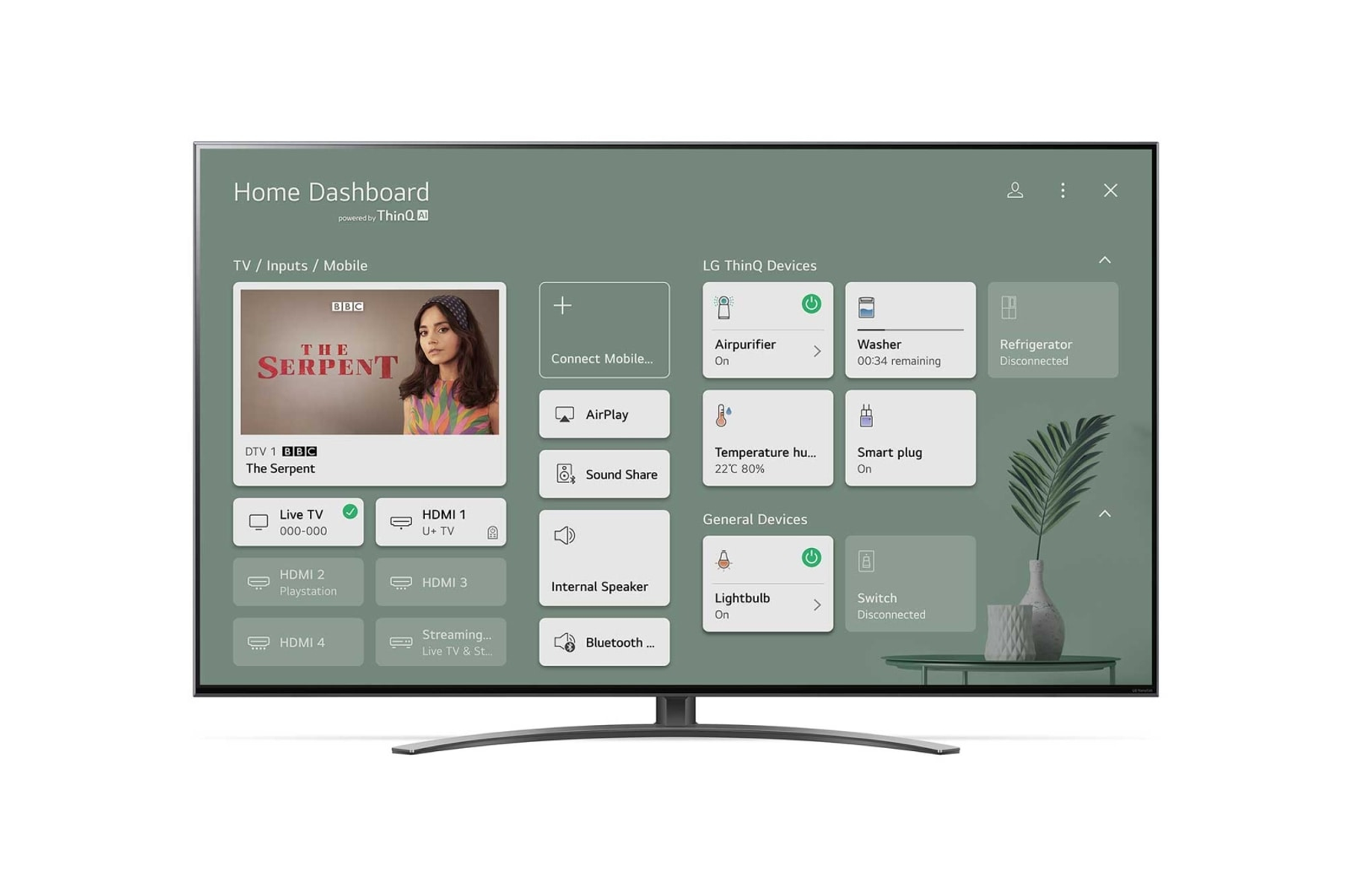 Duży telewizor z płaskim ekranem wyświetlający panel sterowania smart home z kontrolkami urządzeń i zawartością.