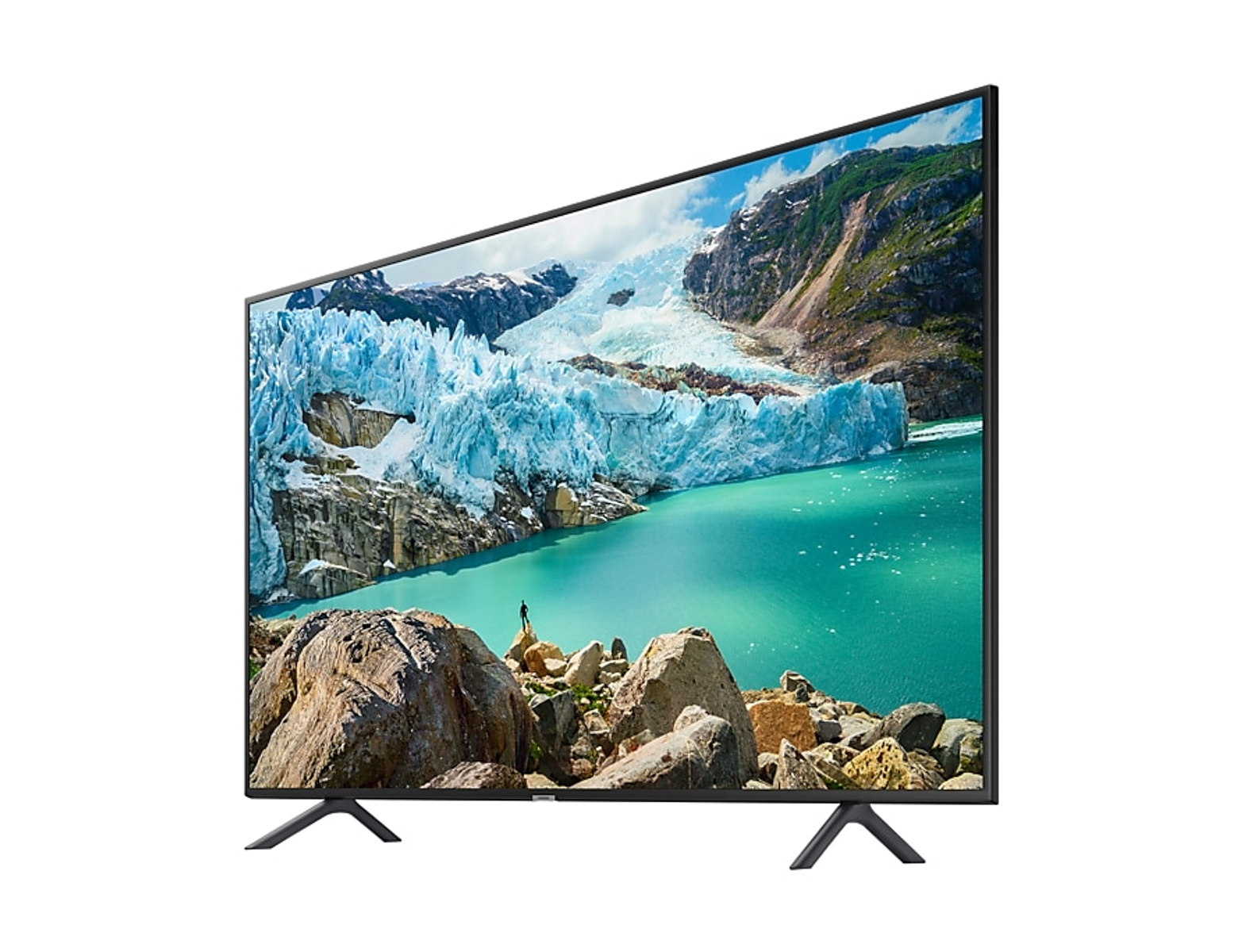 Un televisor Samsung que muestra un paisaje glaciar con un lago y montañas. El televisor está inclinado hacia la izquierda.