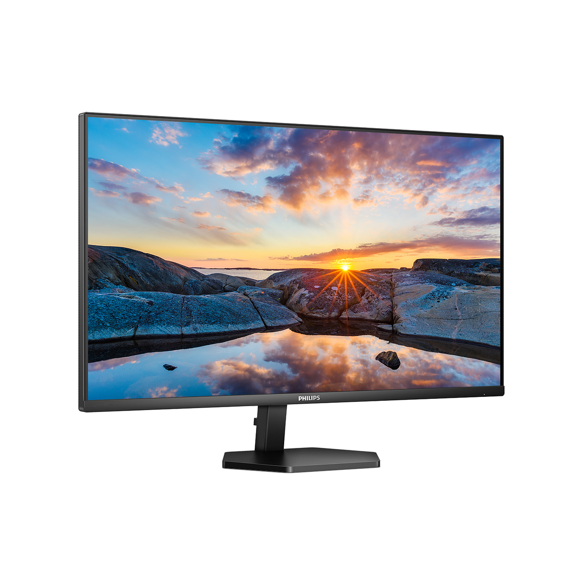 Monitor che mostra il tramonto su rocce e acqua. Cornice nera, sfondo bianco.