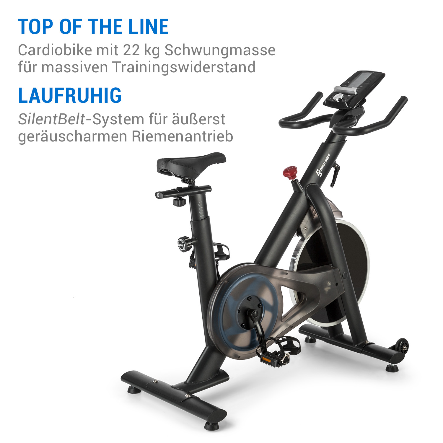 Schwarzes stationäres Trainingsfahrrad. Text lautet 'TOP OF THE LINE' und 'LAUFRUHIG'.