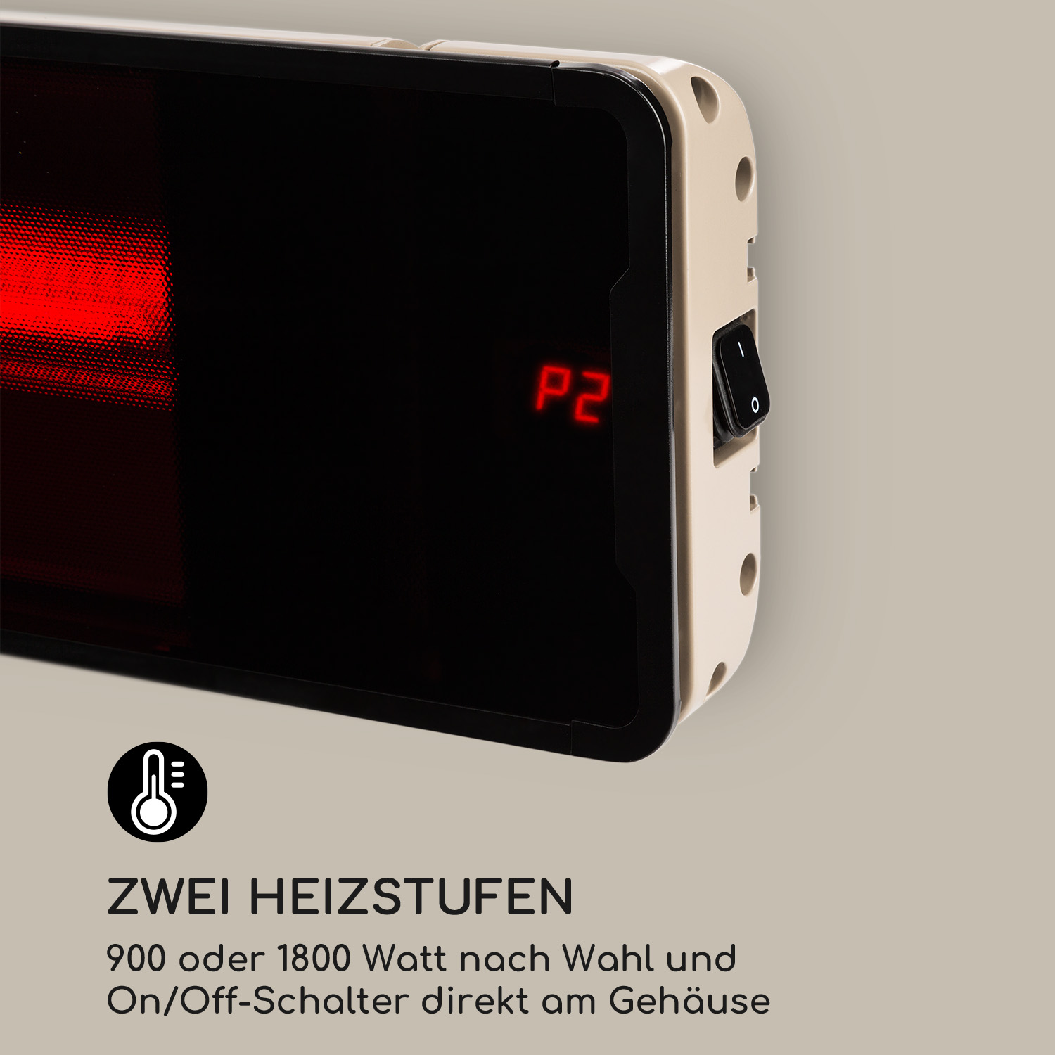 Nahaufnahme einer schwarzen und beigen Heizung mit roter Anzeige und Netzschalter.