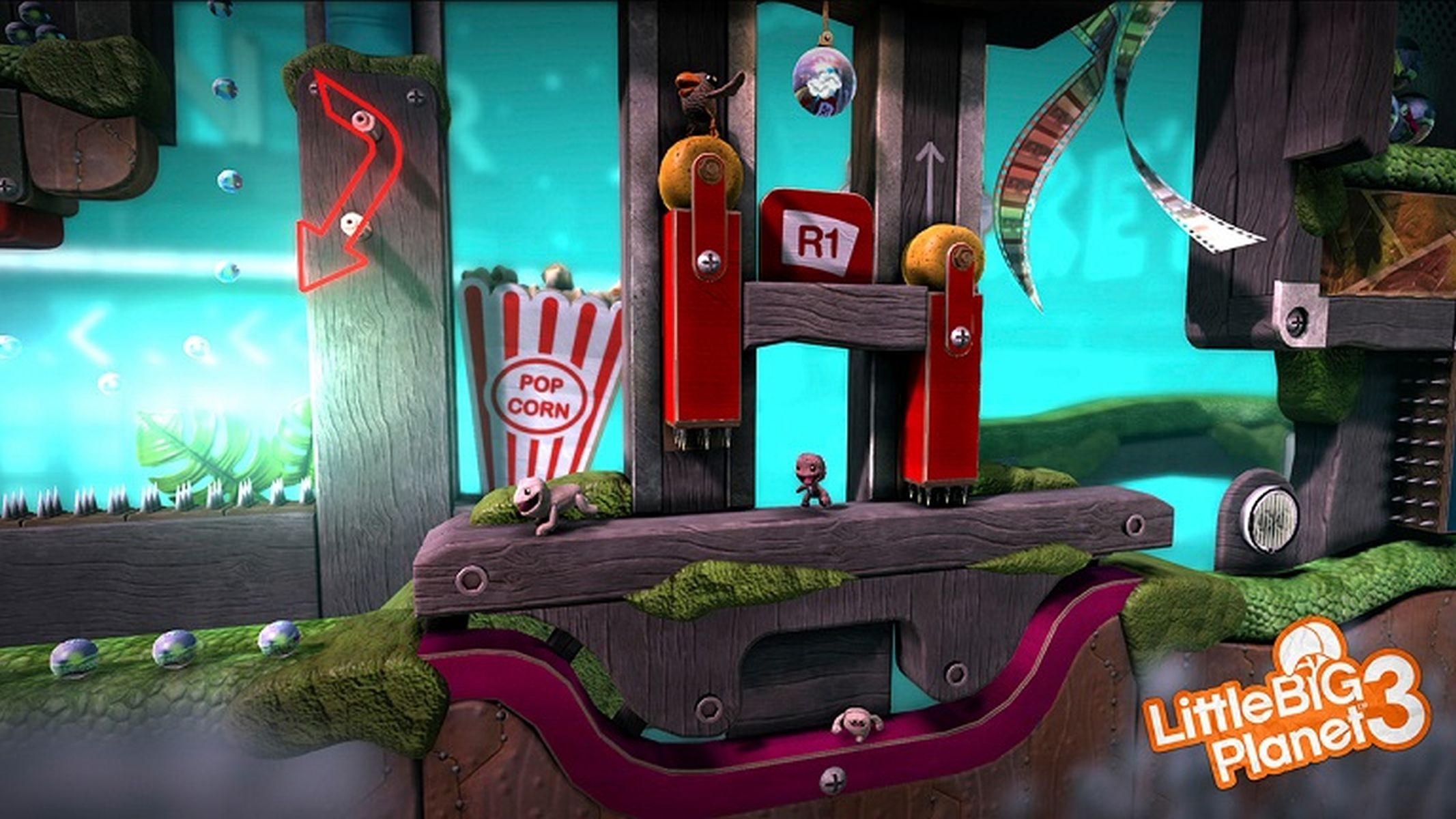 Eine LittleBigPlanet 3-Szene zeigt eine Figur auf einer Holzkonstruktion. Popcorn-Schild. Der Hintergrund ist eine Spielumgebung.