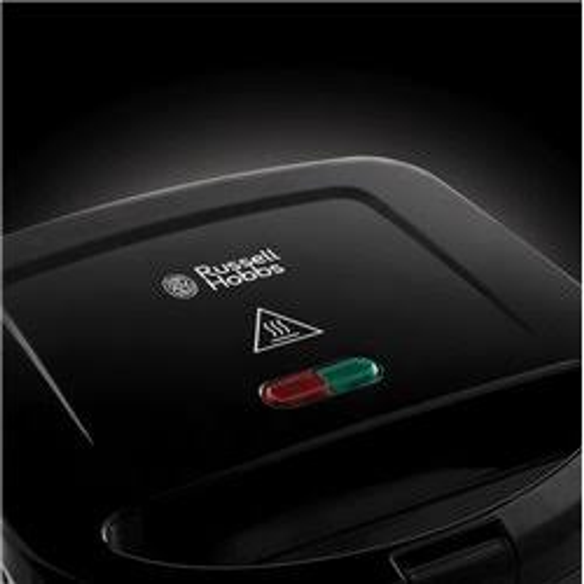 Schwarzer Russell Hobbs Waffelautomat mit roten und grünen Kontrollleuchten. Das Markenlogo ist sichtbar.