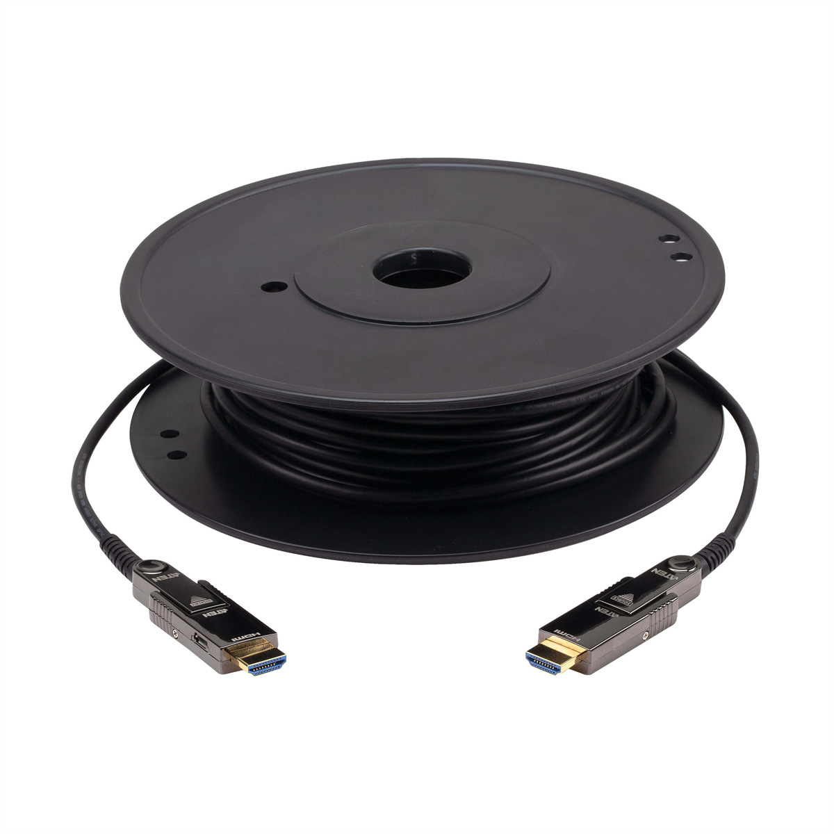 Schwarze Kabelrolle mit HDMI-Anschlüssen. Weißer Hintergrund.