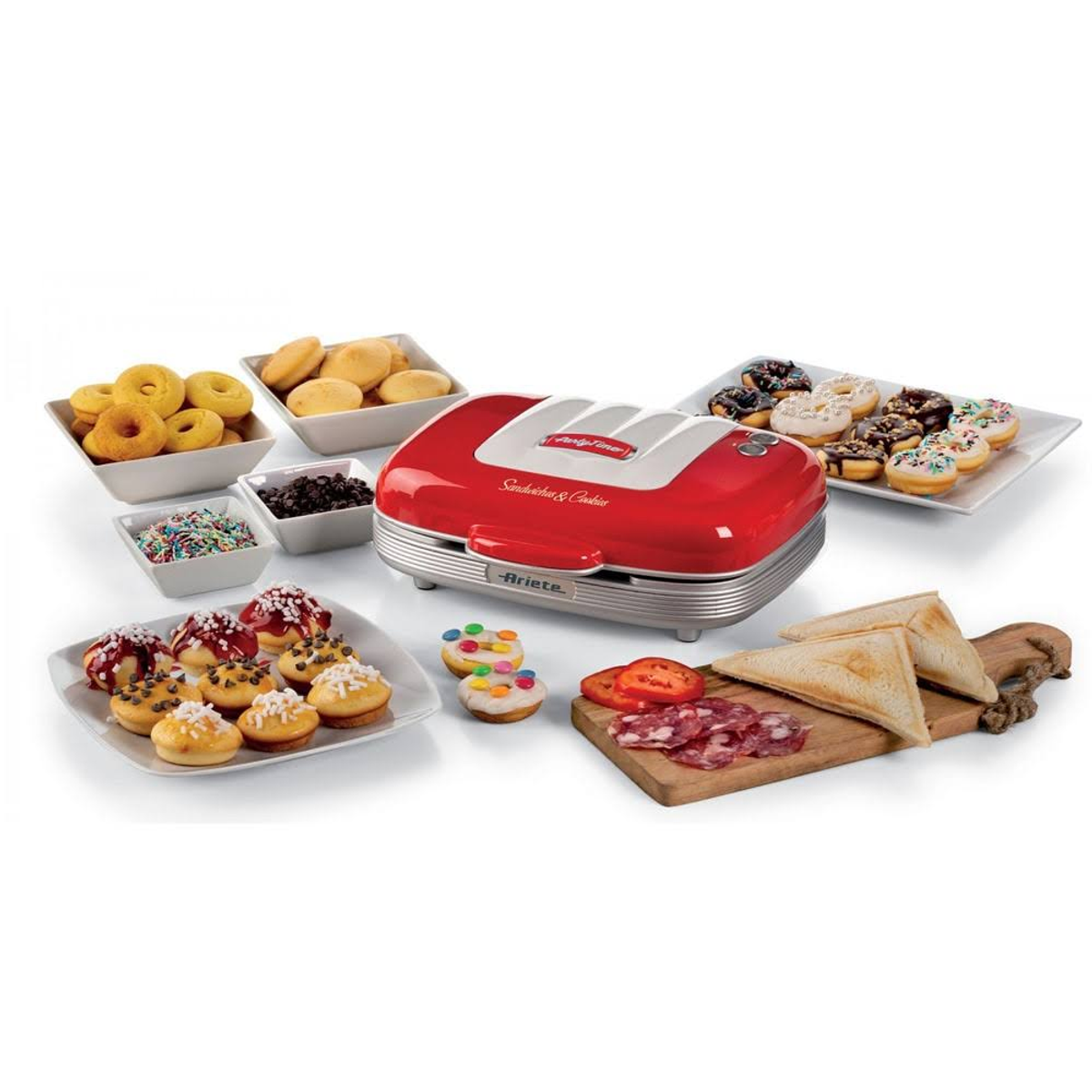 Red sandwich and cookie maker with food and decorations.