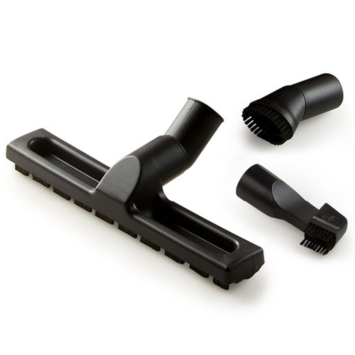 Accesorios de aspiradora negros: cepillo grande, cepillo pequeño, boquilla.