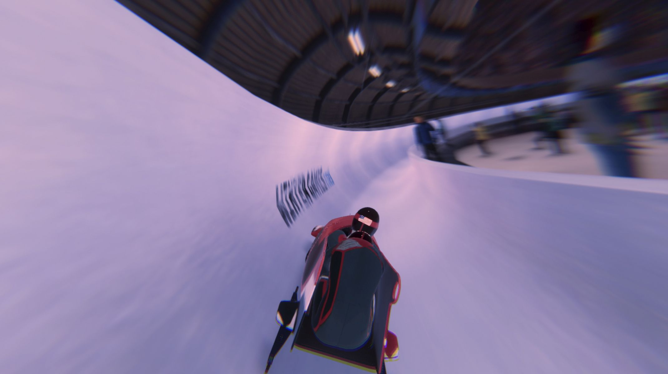 Un bob che corre giù per una pista ghiacciata, effetto mosso, un bob rosso e nero.