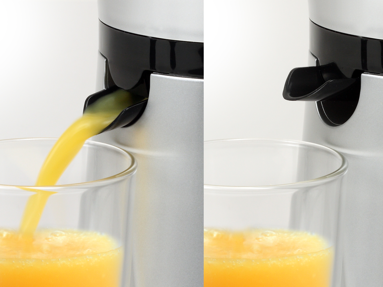 Saft wird aus einer silbernen Saftpresse in ein Glas gegossen. Orangensaft sichtbar.