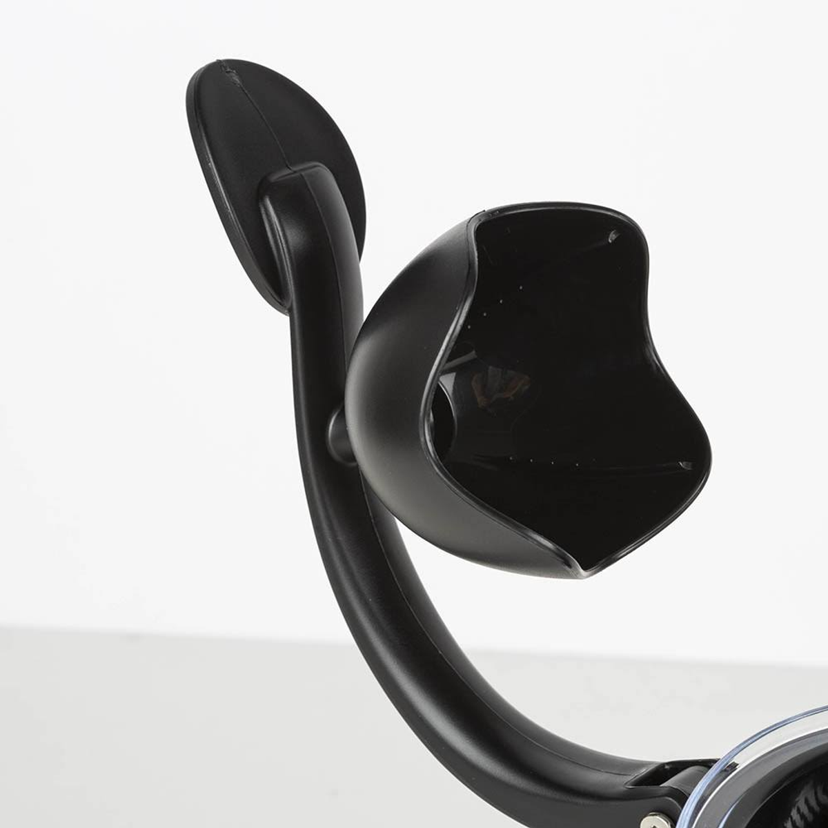 Un dispositivo de plástico negro con un brazo curvo y un soporte en forma de copa.