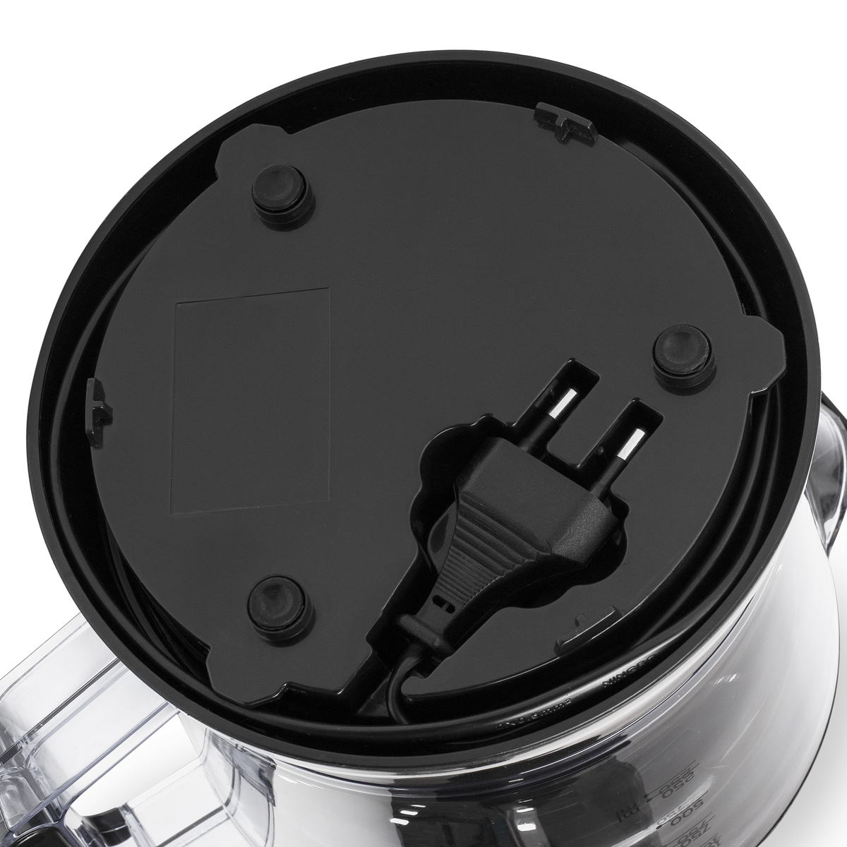 Widok od spodu urządzenia z wtyczką. Wtyczka jest czarna z dwoma bolcami i przewodem.