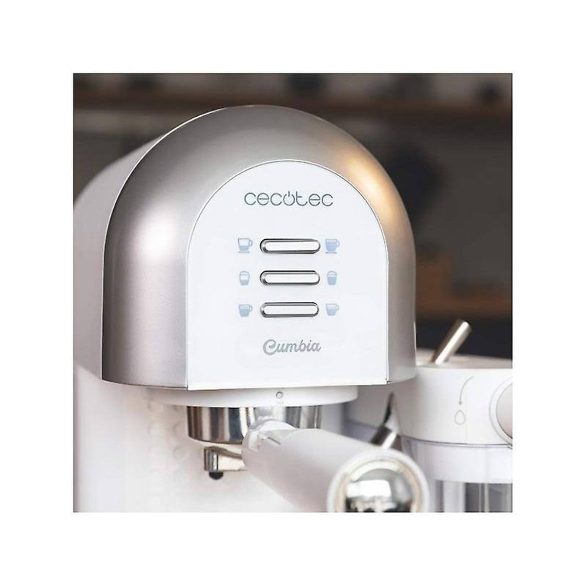 Biały i srebrny ekspres do kawy, z marką Cumbia. Widoczne są trzy przyciski.