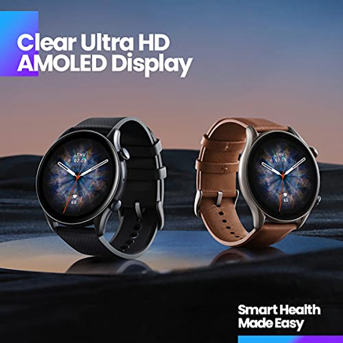 Due smartwatch con quadranti rotondi. Cinturini neri e marroni. Display AMOLED.