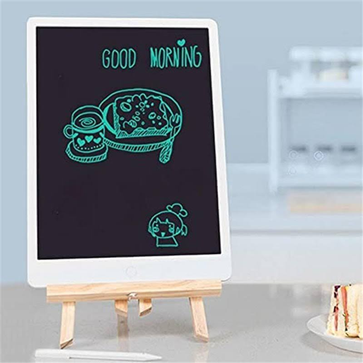 Un tablet per disegnare con un disegno sopra e una penna. Il disegno dice "Buongiorno".