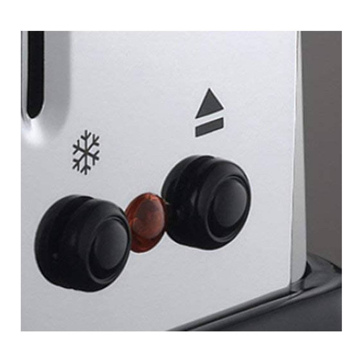 Zbliżenie tostera z pokrętłami i symbolem płatka śniegu.