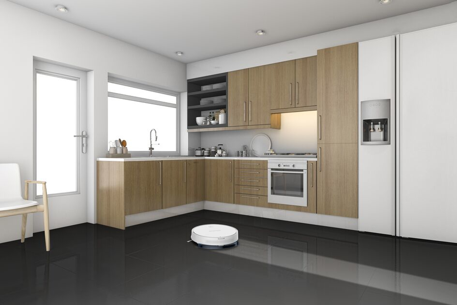 Nowoczesna kuchnia z czarną podłogą i drewnianymi szafkami. Odkurzacz robot jest na podłodze na pierwszym planie.