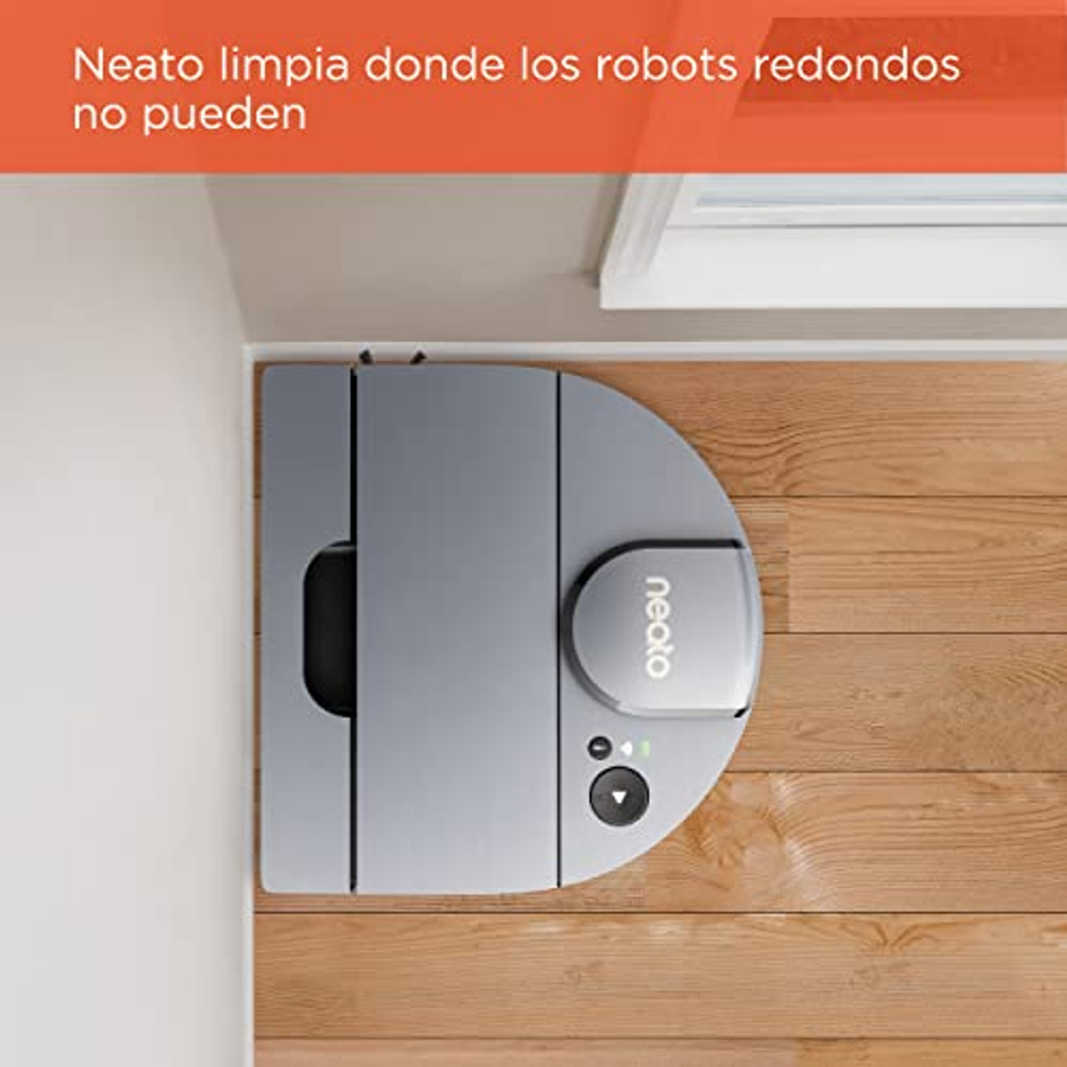 Grauer Neato-Roboter-Staubsauger in einer Ecke, Text: "Neato reinigt, wo runde Roboter nicht können".