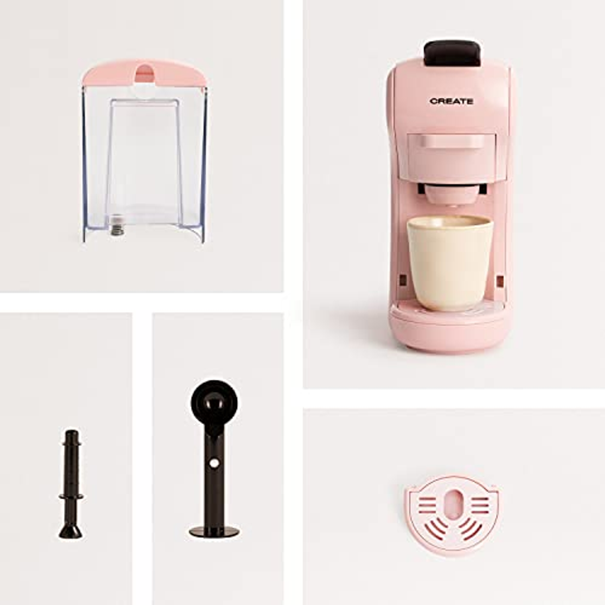 Cafetera rosa con componentes sobre fondo blanco: depósito de agua, accesorios y taza.