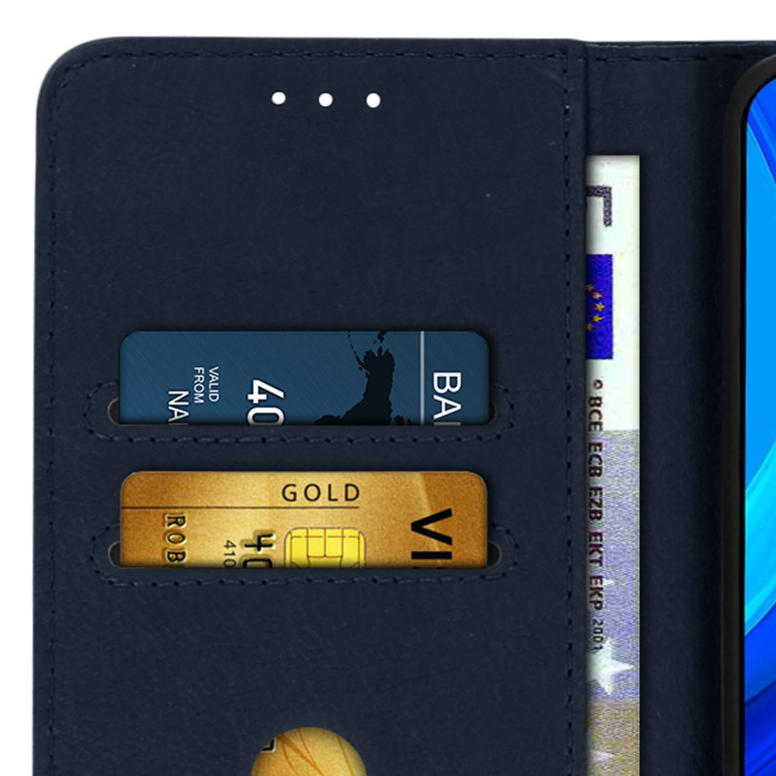 Portafoglio aperto con carte di credito e denaro. Portafoglio in pelle blu, due carte d'oro visibili.