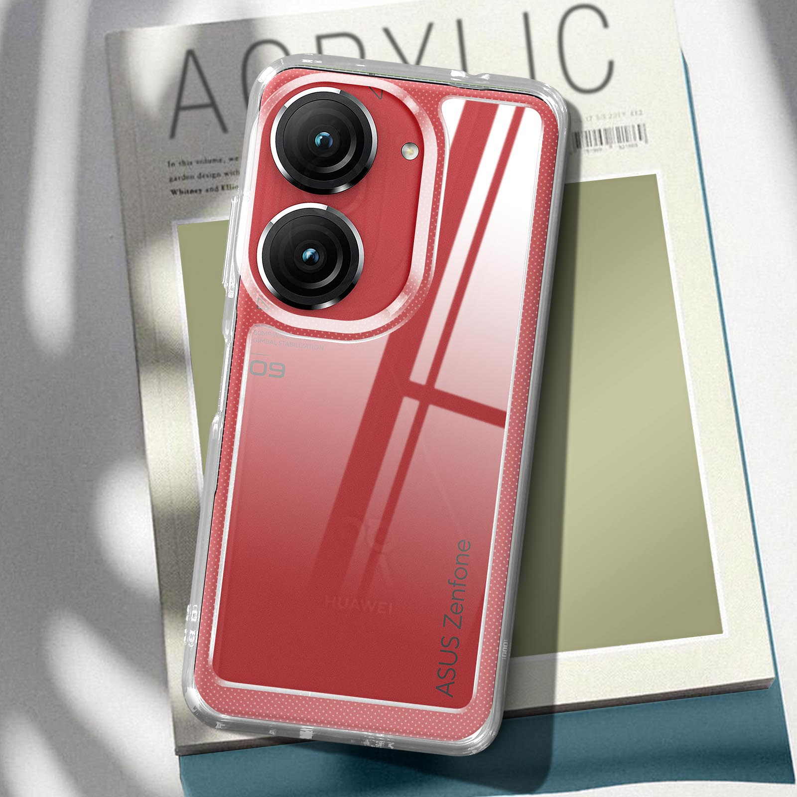 Custodia rossa per telefono su rivista con copertina trasparente. Ha due fotocamere. Marchio ASUS.