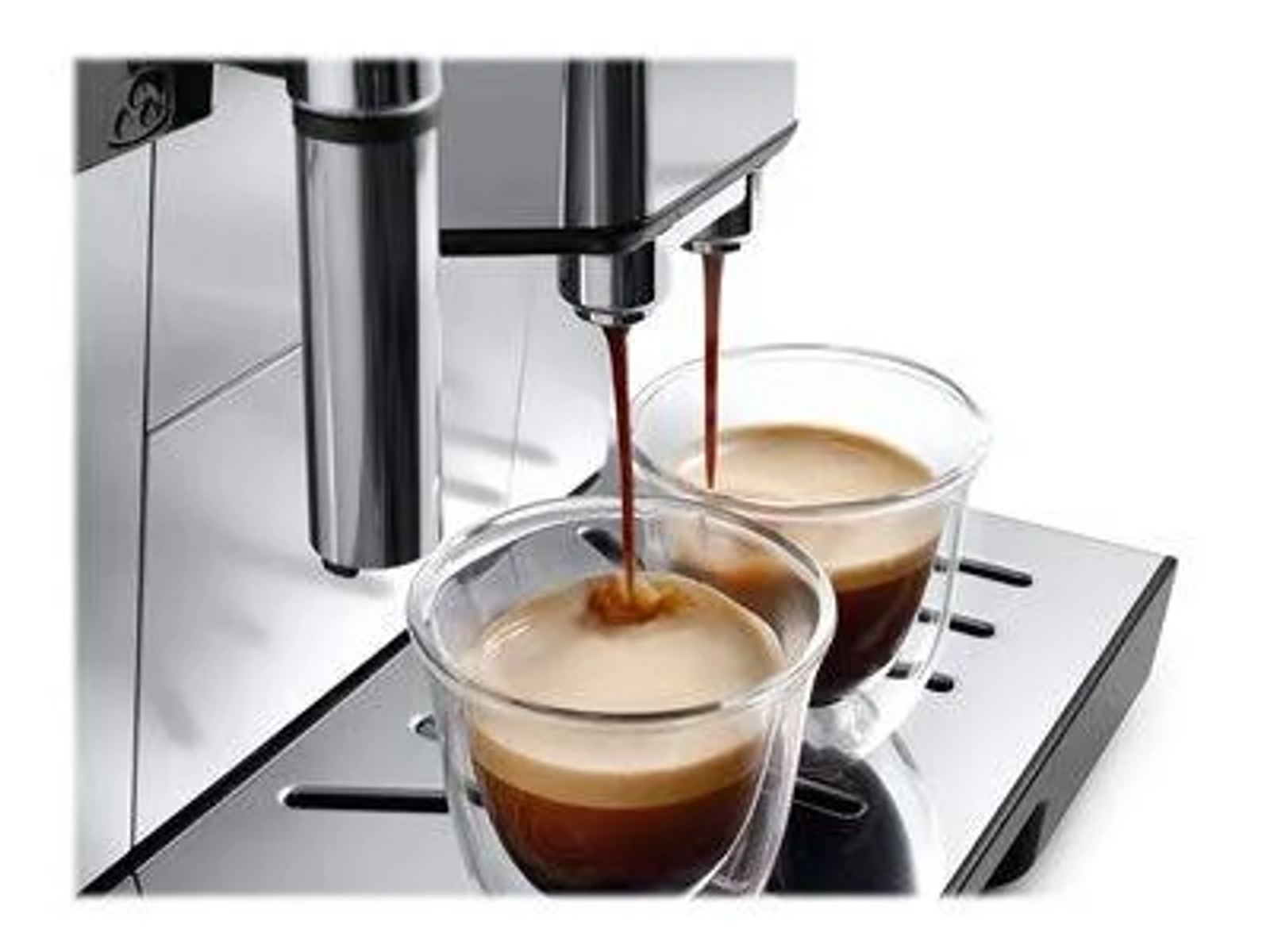 Macchina per espresso che eroga caffè in due bicchieri di vetro trasparente su un vassoio.