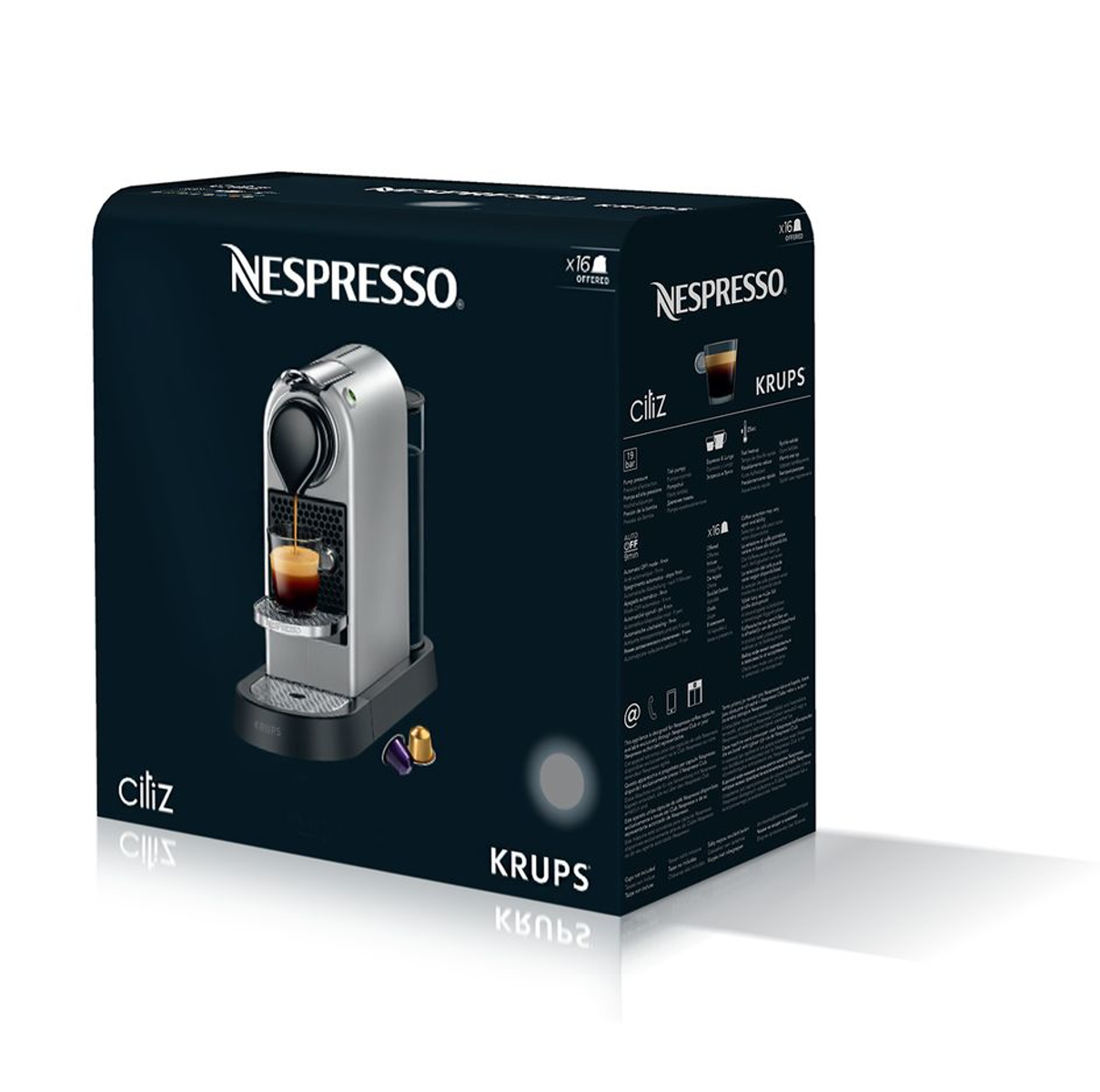 Scatola macchina da caffè Nespresso che mostra macchina argento e tazza di caffè.