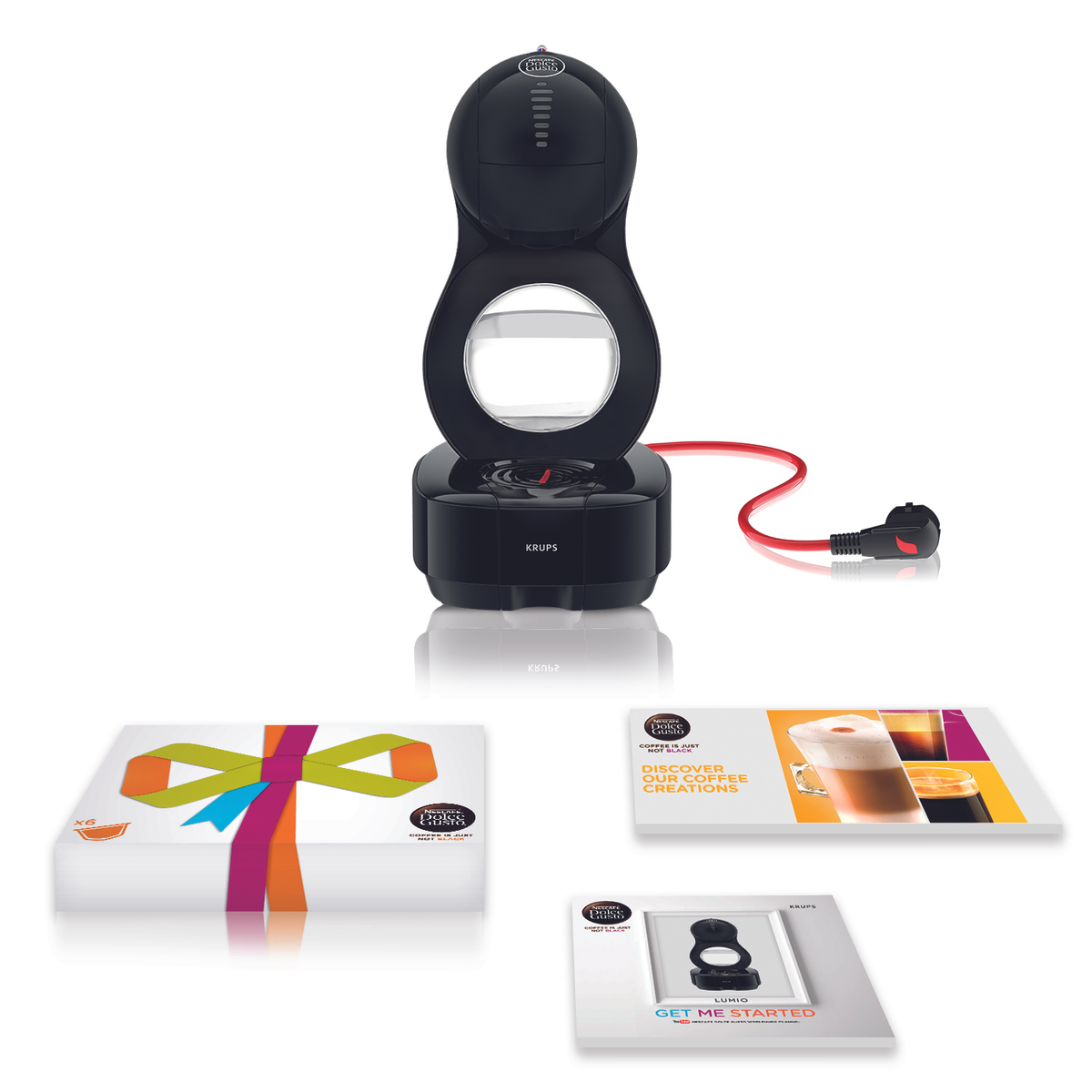 Una cafetera Krups Dolce Gusto negra con accesorios y embalaje.