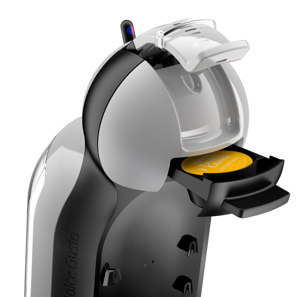 Macchina da caffè Dolce Gusto bianca e nera con capsula gialla inserita.