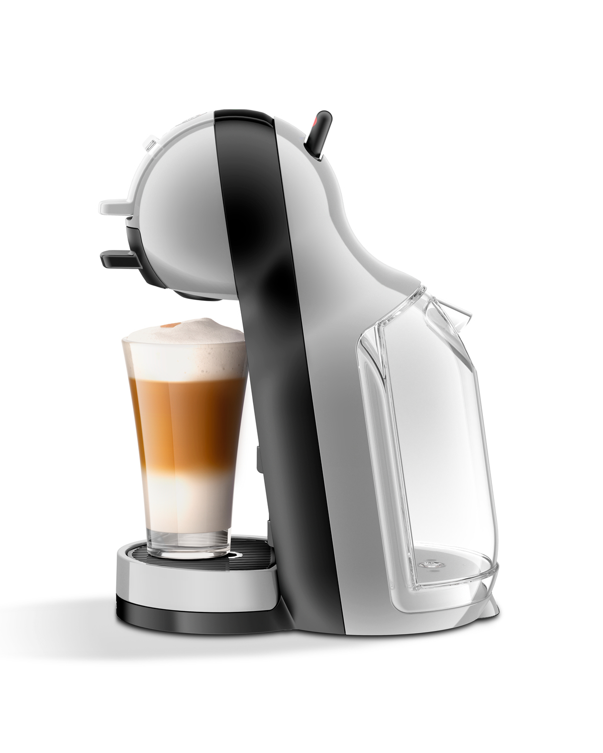 Macchina da caffè Nespresso bianca e nera con un bicchiere di latte macchiato, vista laterale.