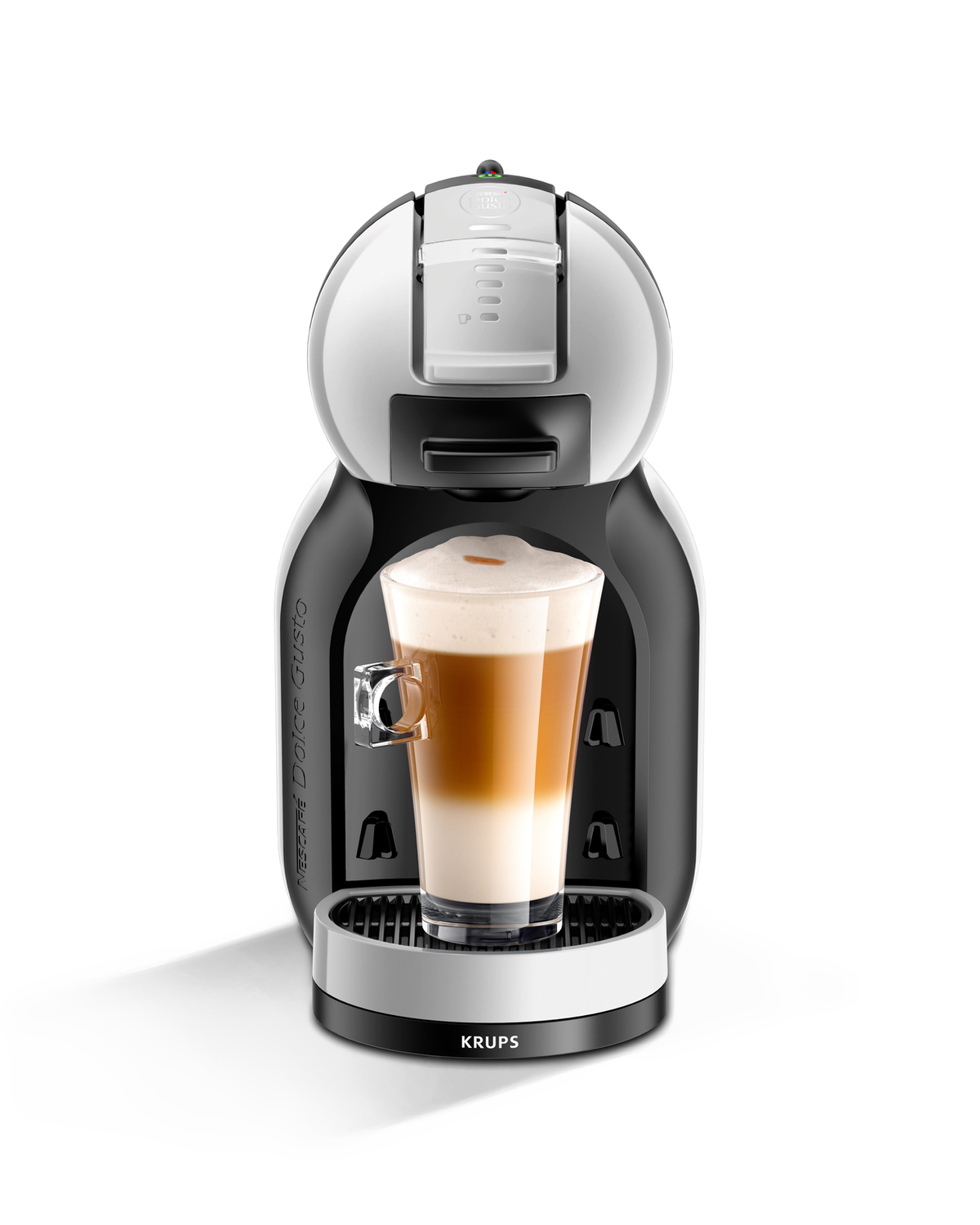 Una macchina da caffè in bianco e nero con un bicchiere di latte.
