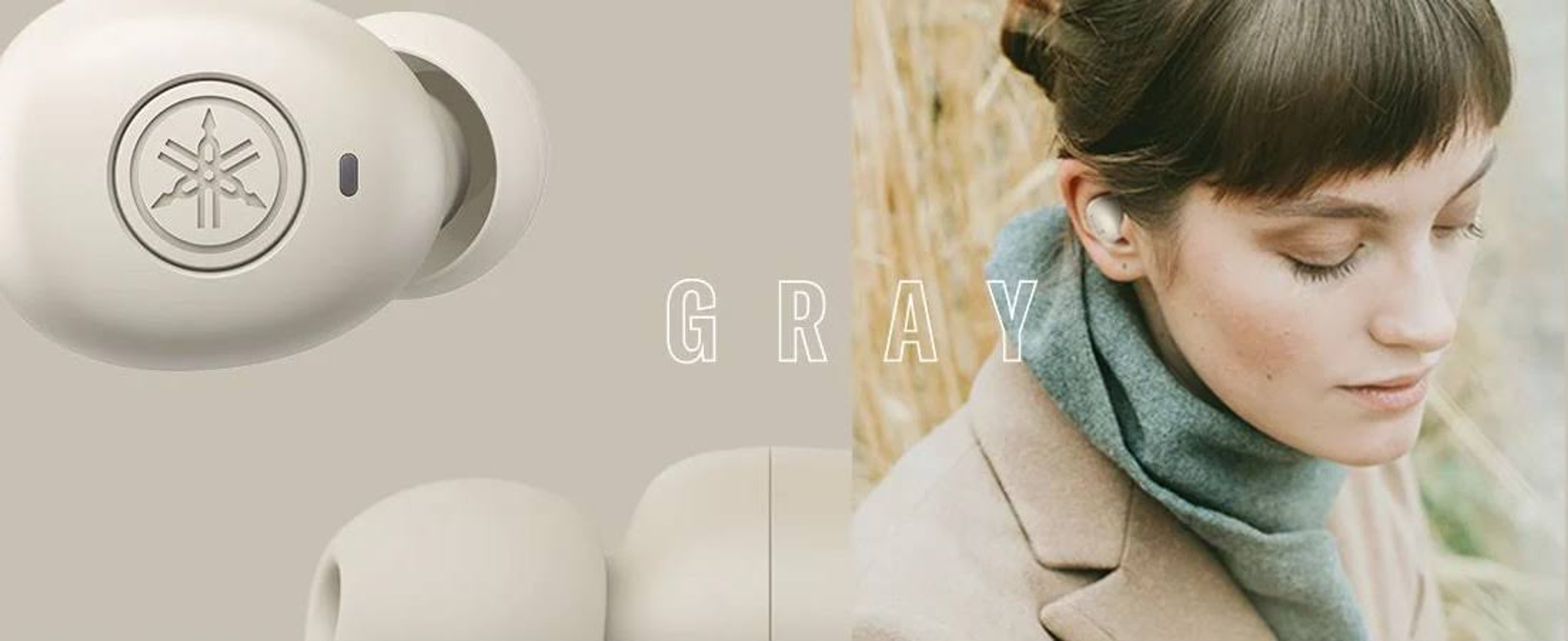 Eine Frau mit grauen Ohrhörern, daneben steht das Wort "GRAU".