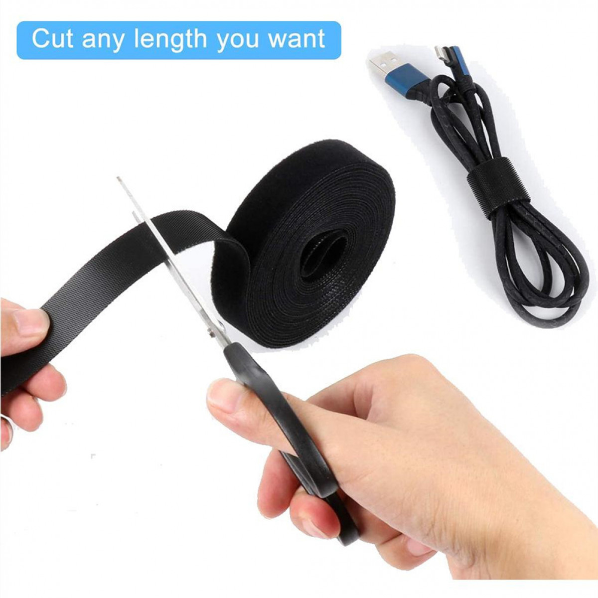 Osoba tnie czarny pasek na rzep nożyczkami. Po prawej stronie znajduje się kabel.