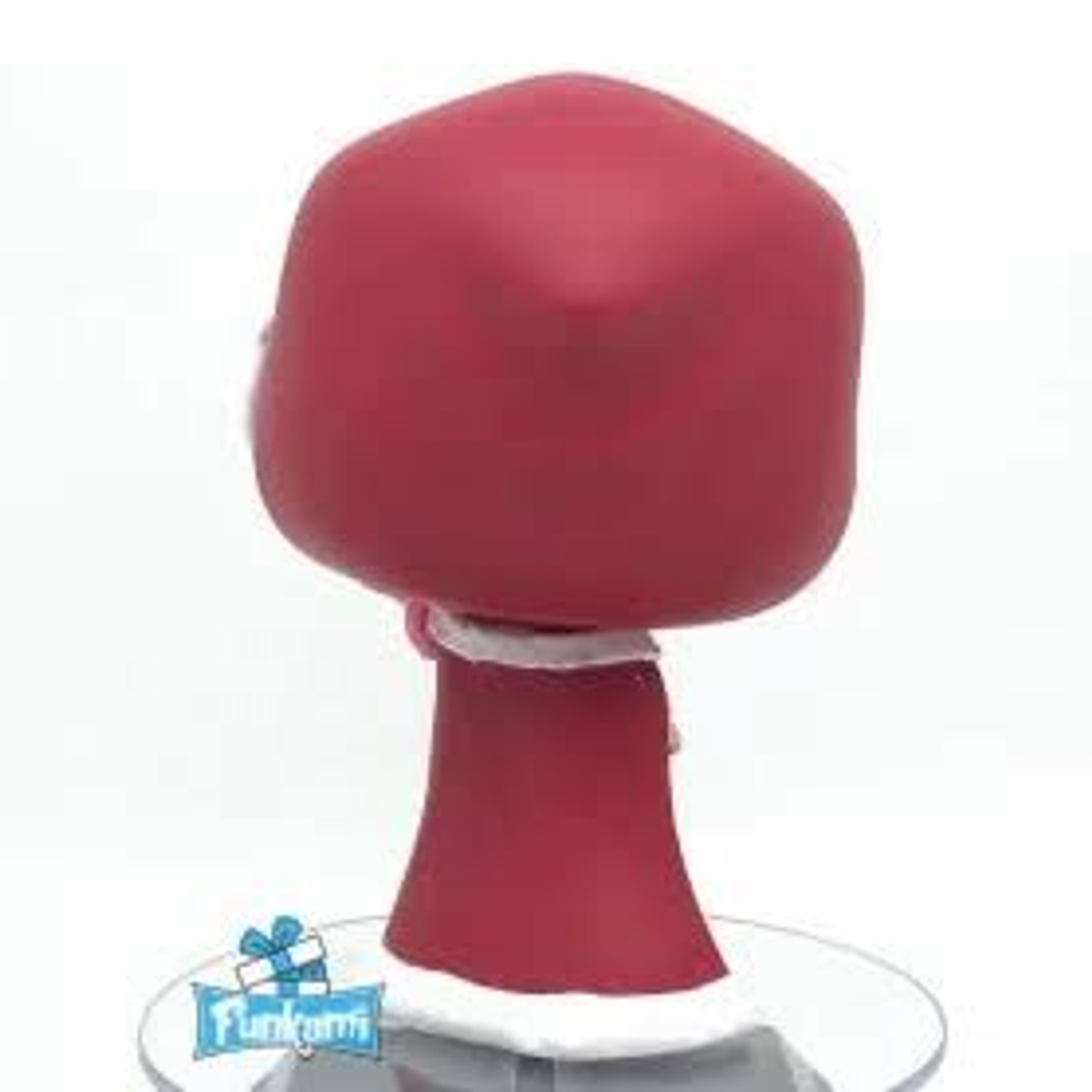 Una figura Funko Pop! rossa vista da dietro su un supporto. È una figura che indossa un cappotto rosso.