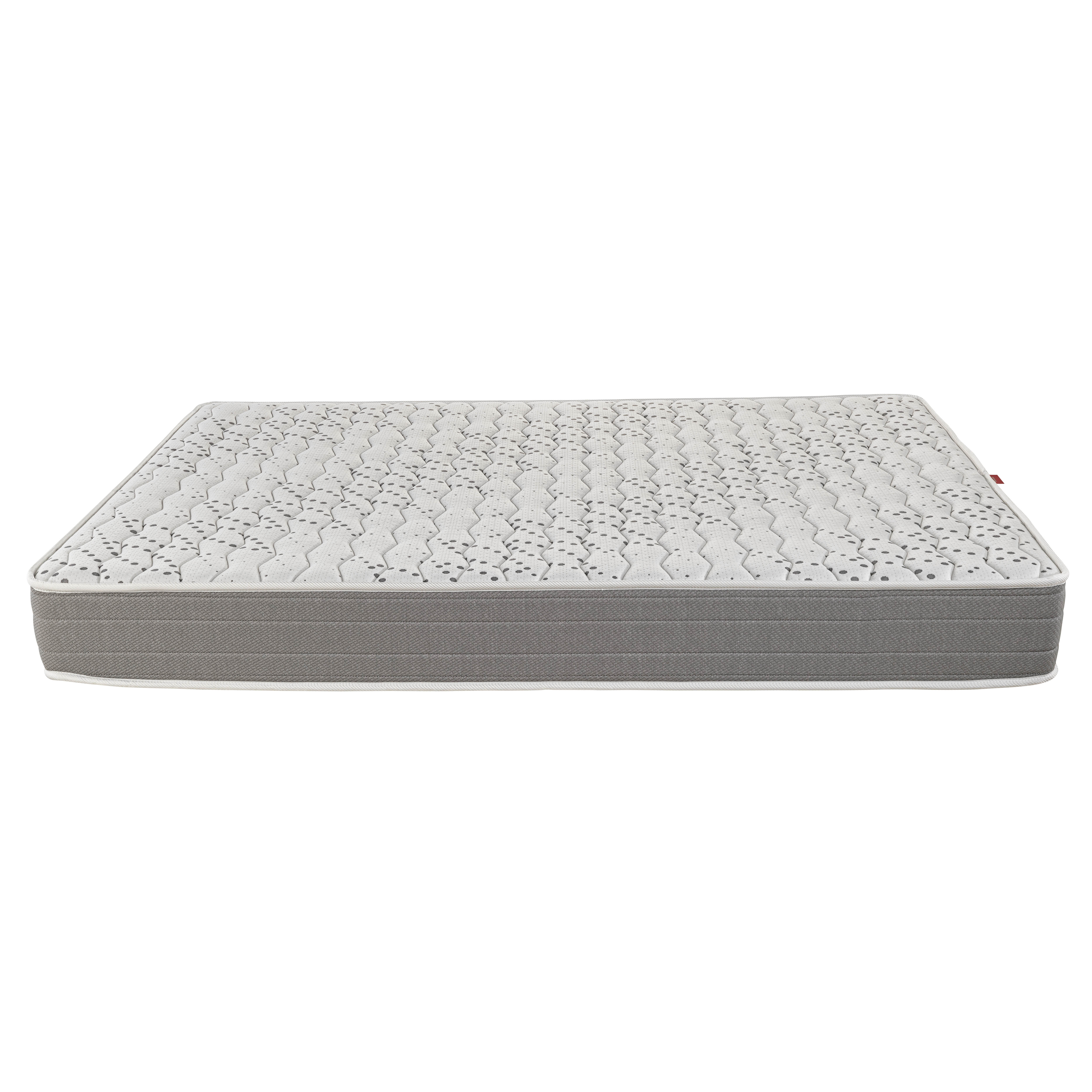 Un colchón blanco y gris con superficie estampada y borde gris.