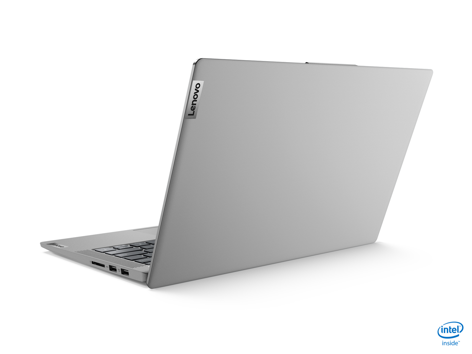 Laptop Lenovo plateado, vista en ángulo, ligeramente abierto. Logo Intel, fondo blanco.