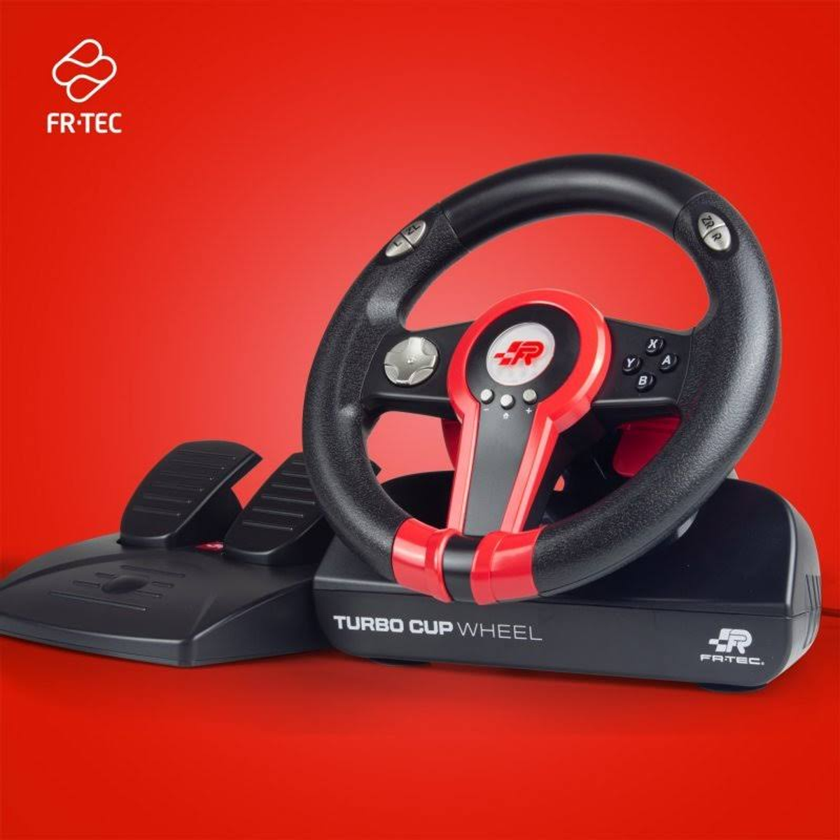 Volante con pedales. Volante negro con detalles en rojo y base negra. Fondo rojo.