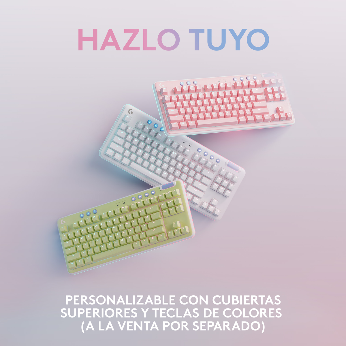 Trzy klawiatury w różnych kolorach: różowym, białym i zielonym. Tekst: HAZLO TUYO.