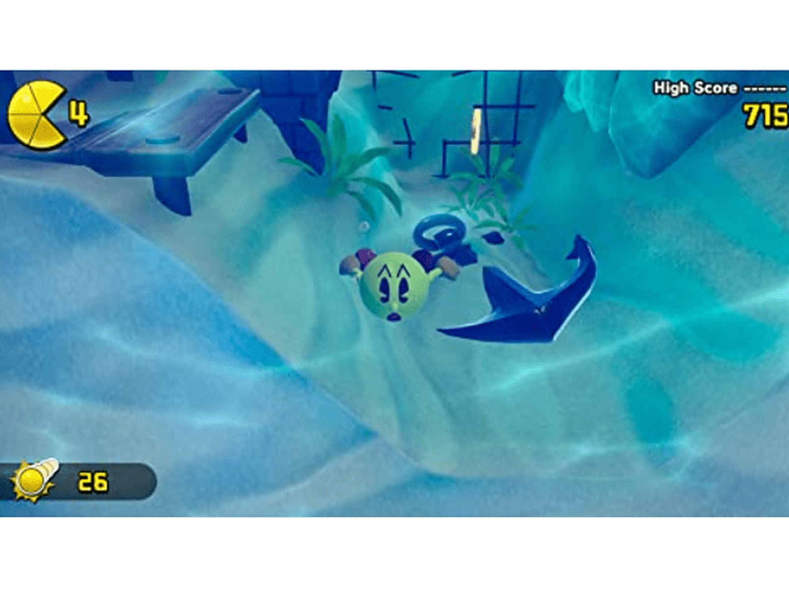 Un personaje amarillo similar a Pac-Man nada en una escena submarina azul, con una manta raya e indicadores de puntuación.