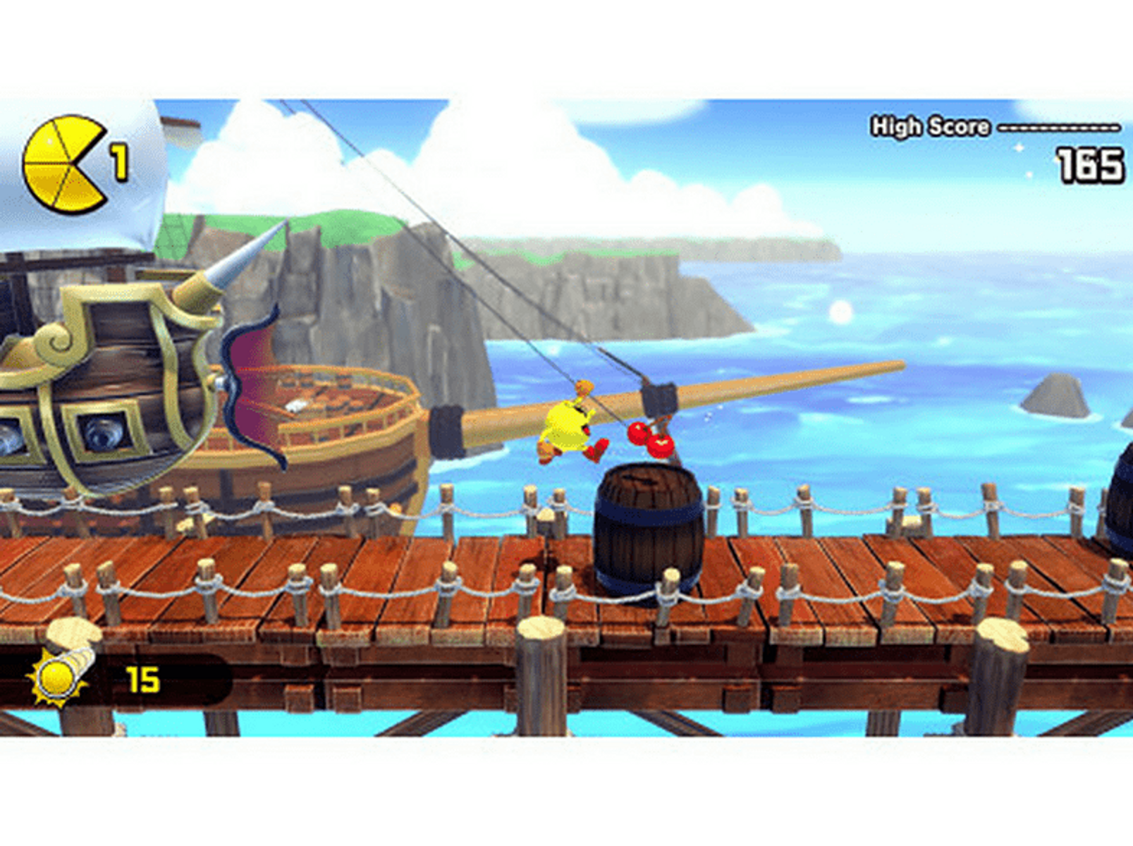 Personaje de Pac-Man en un muelle, con un barco pirata de fondo. La puntuación más alta es 165, con un barril presente.