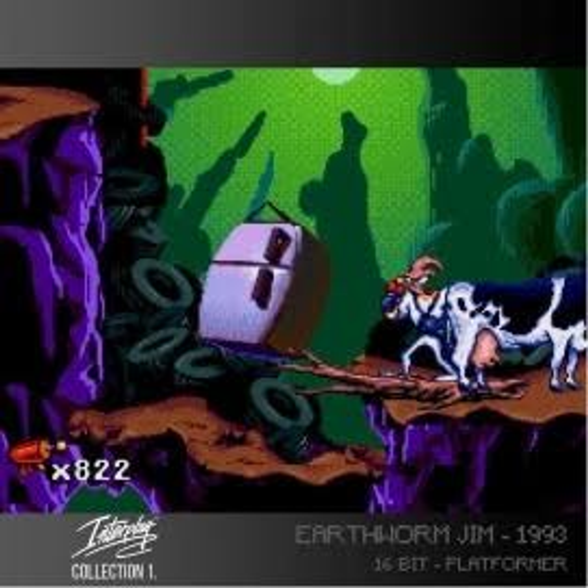 Scena di gioco retrò con un frigorifero, mucche ed Earthworm Jim, con uno sfondo verde neon.