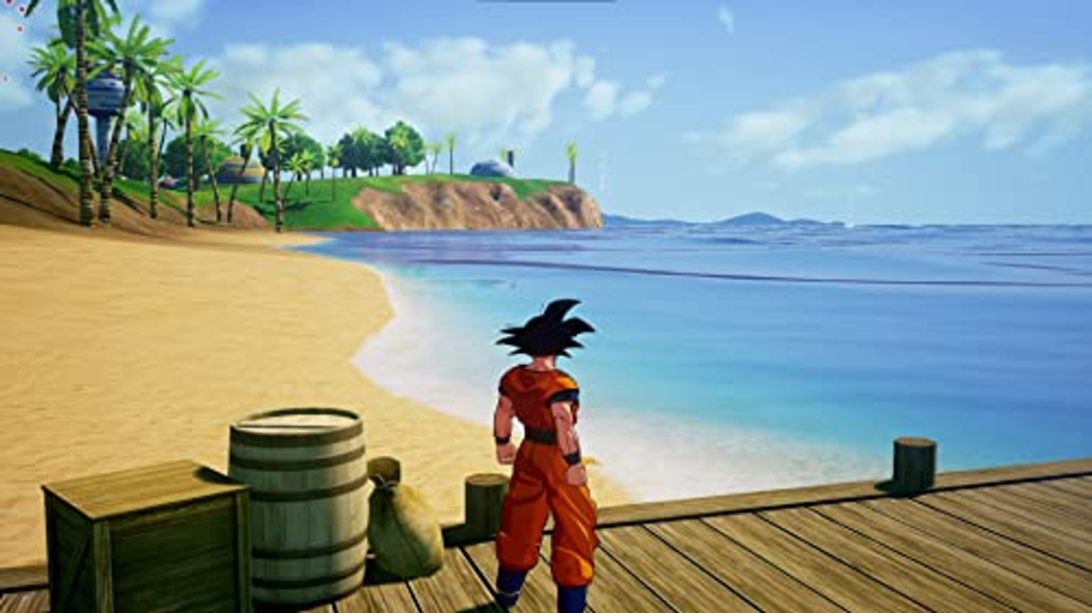 Goku stoi na molo, w tle plaża i ocean. Widoczne są palmy i błękitne niebo.