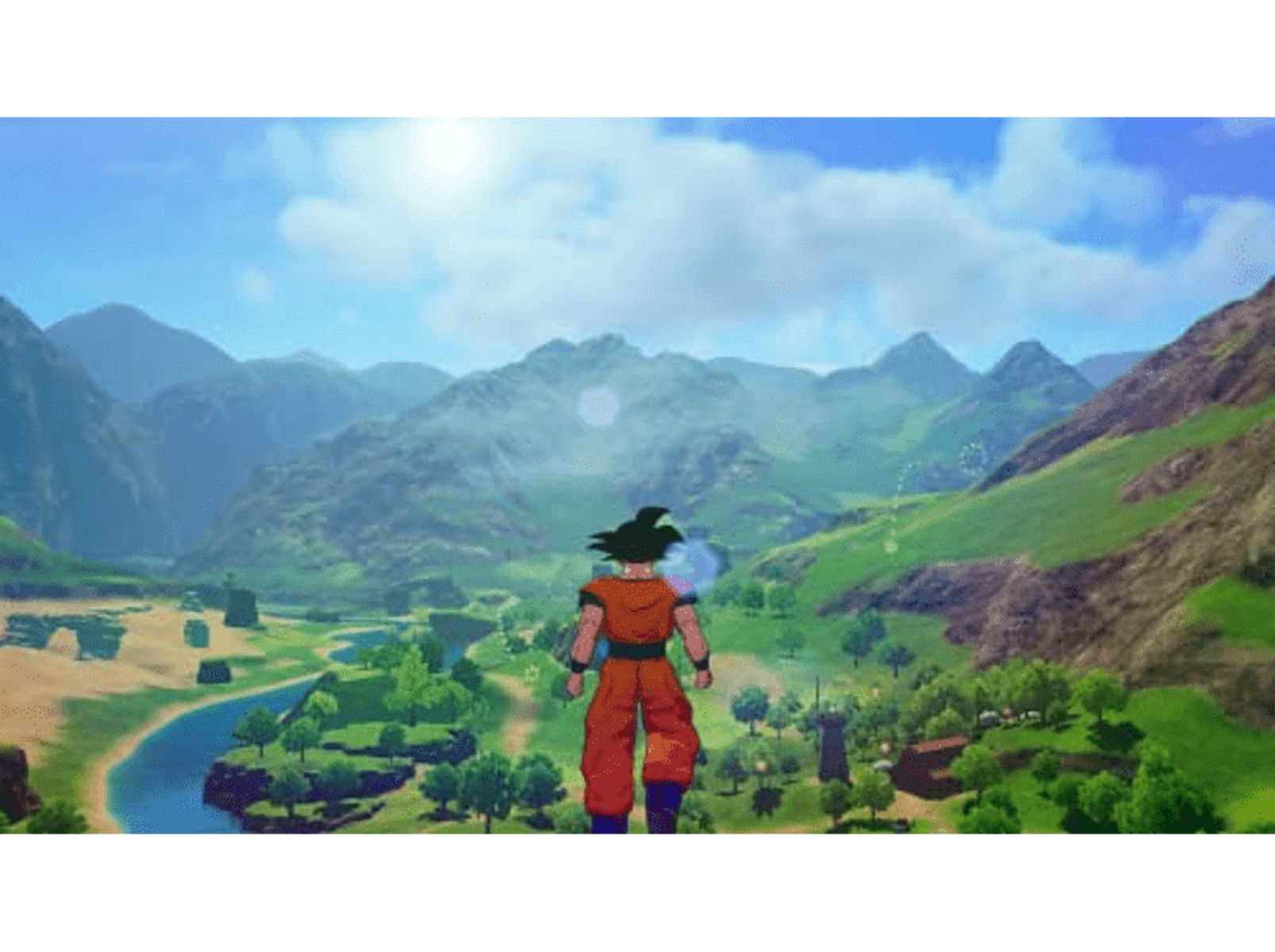 Goku stoi na polu z widokiem na dolinę z górami i rzeką.