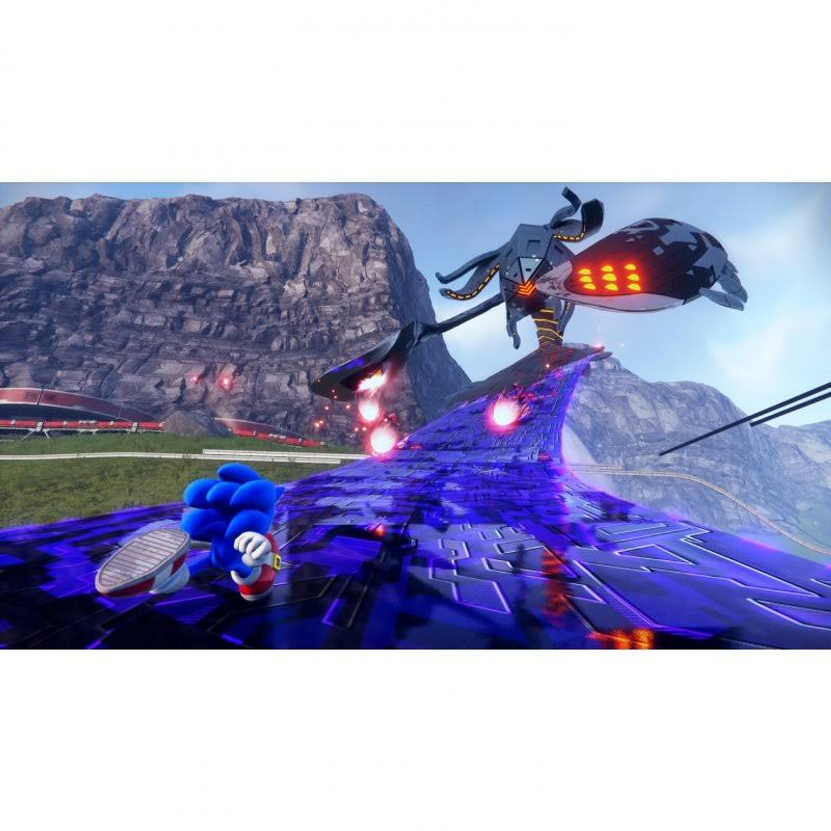 Sonic corre en una pista morada con una criatura similar a un pulpo sobre una montaña.
